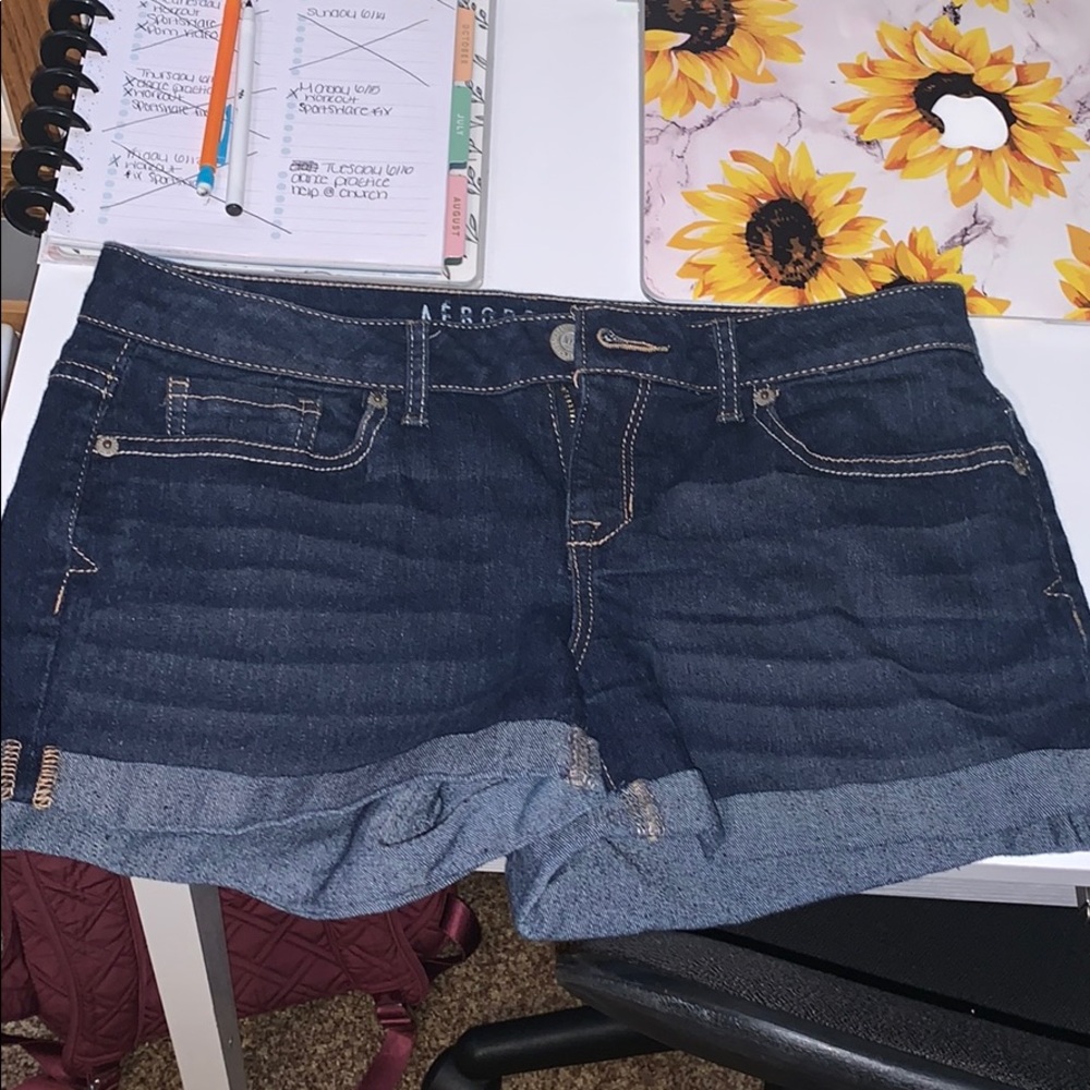 Dark denim shorts.